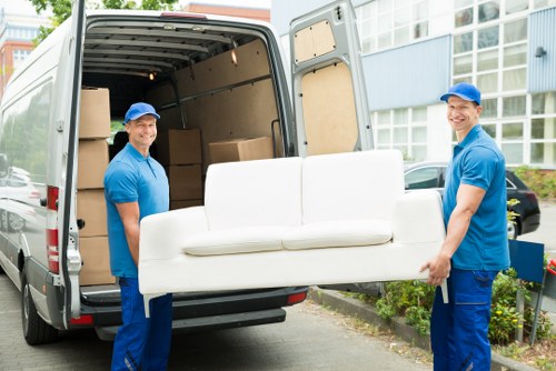 Man With Van Harringay team safely handling boxes during a move