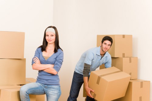 Packed boxes and wrapped furniture ready for a local home removal