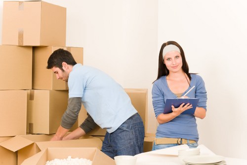 Local moving team loading furniture into a van in North London