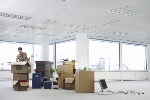 Packed office boxes and furniture ready for relocation